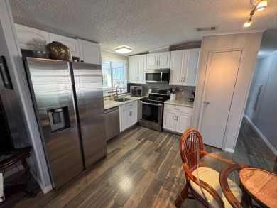 ***JUST REDUCED***This 2/2 1045 sq ft home is beautifully on Lake Henry Golf Club in Florida - for sale on GolfHomes.com, golf home, golf lot