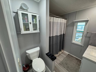 ***JUST REDUCED***This 2/2 1045 sq ft home is beautifully on Lake Henry Golf Club in Florida - for sale on GolfHomes.com, golf home, golf lot