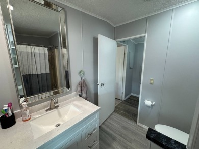 ***JUST REDUCED***This 2/2 1045 sq ft home is beautifully on Lake Henry Golf Club in Florida - for sale on GolfHomes.com, golf home, golf lot