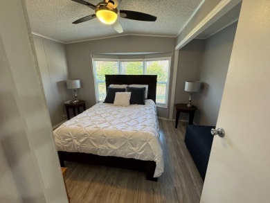 ***JUST REDUCED***This 2/2 1045 sq ft home is beautifully on Lake Henry Golf Club in Florida - for sale on GolfHomes.com, golf home, golf lot