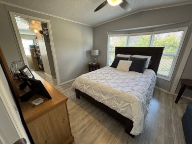 ***JUST REDUCED***This 2/2 1045 sq ft home is beautifully on Lake Henry Golf Club in Florida - for sale on GolfHomes.com, golf home, golf lot