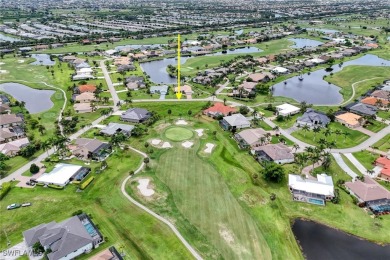 Nestled in the heart of Cape Coral, this extraordinary property on Royal Tee Country Club in Florida - for sale on GolfHomes.com, golf home, golf lot