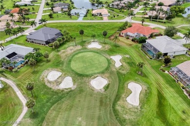 Nestled in the heart of Cape Coral, this extraordinary property on Royal Tee Country Club in Florida - for sale on GolfHomes.com, golf home, golf lot