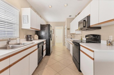 Welcoming Two Bedroom plus Den/Office with French Doors, Two on Waterford Golf Club in Florida - for sale on GolfHomes.com, golf home, golf lot