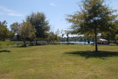 Corner, cul-de-sac lot located in a gated, lakeside, golf course on Players Course At Wyboo Plantation in South Carolina - for sale on GolfHomes.com, golf home, golf lot