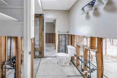 This well maintained concrete block corner home sustained flood on Mangrove Bay Golf Course in Florida - for sale on GolfHomes.com, golf home, golf lot