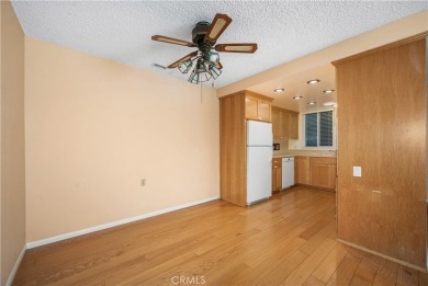 Step into this beautifully reimagined upstairs corner unit in on Leisure World Seal Beach Golf Course in California - for sale on GolfHomes.com, golf home, golf lot