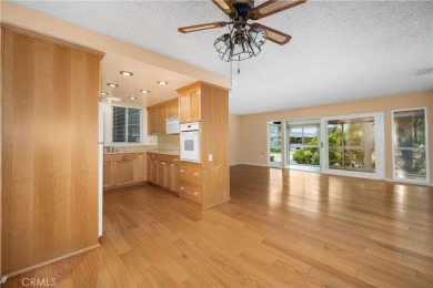 Step into this beautifully reimagined upstairs corner unit in on Leisure World Seal Beach Golf Course in California - for sale on GolfHomes.com, golf home, golf lot