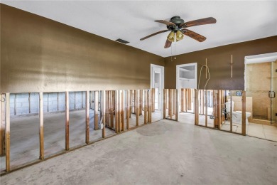 This well maintained concrete block corner home sustained flood on Mangrove Bay Golf Course in Florida - for sale on GolfHomes.com, golf home, golf lot