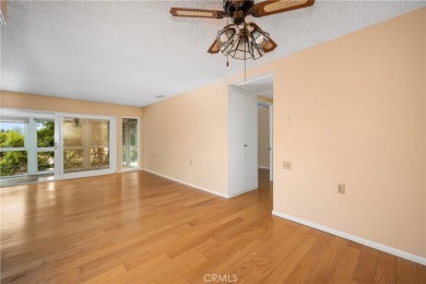 Step into this beautifully reimagined upstairs corner unit in on Leisure World Seal Beach Golf Course in California - for sale on GolfHomes.com, golf home, golf lot