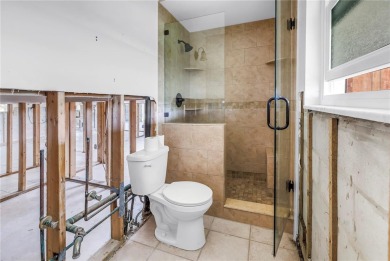 This well maintained concrete block corner home sustained flood on Mangrove Bay Golf Course in Florida - for sale on GolfHomes.com, golf home, golf lot