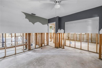 This well maintained concrete block corner home sustained flood on Mangrove Bay Golf Course in Florida - for sale on GolfHomes.com, golf home, golf lot
