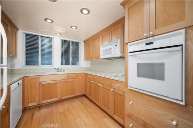 Step into this beautifully reimagined upstairs corner unit in on Leisure World Seal Beach Golf Course in California - for sale on GolfHomes.com, golf home, golf lot
