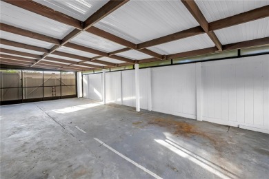 This well maintained concrete block corner home sustained flood on Mangrove Bay Golf Course in Florida - for sale on GolfHomes.com, golf home, golf lot