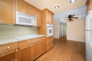 Step into this beautifully reimagined upstairs corner unit in on Leisure World Seal Beach Golf Course in California - for sale on GolfHomes.com, golf home, golf lot