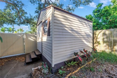 This well maintained concrete block corner home sustained flood on Mangrove Bay Golf Course in Florida - for sale on GolfHomes.com, golf home, golf lot