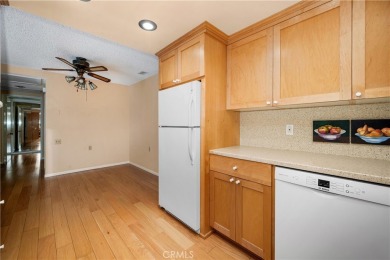 Step into this beautifully reimagined upstairs corner unit in on Leisure World Seal Beach Golf Course in California - for sale on GolfHomes.com, golf home, golf lot
