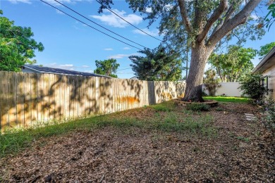 This well maintained concrete block corner home sustained flood on Mangrove Bay Golf Course in Florida - for sale on GolfHomes.com, golf home, golf lot