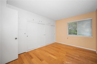 Step into this beautifully reimagined upstairs corner unit in on Leisure World Seal Beach Golf Course in California - for sale on GolfHomes.com, golf home, golf lot