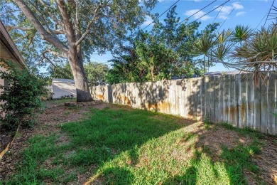 This well maintained concrete block corner home sustained flood on Mangrove Bay Golf Course in Florida - for sale on GolfHomes.com, golf home, golf lot