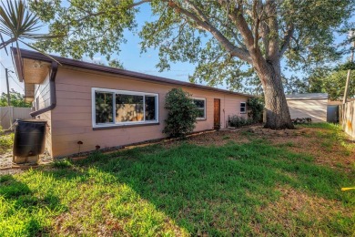 This well maintained concrete block corner home sustained flood on Mangrove Bay Golf Course in Florida - for sale on GolfHomes.com, golf home, golf lot