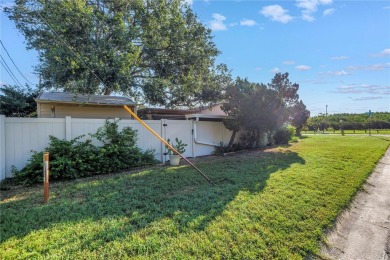 This well maintained concrete block corner home sustained flood on Mangrove Bay Golf Course in Florida - for sale on GolfHomes.com, golf home, golf lot