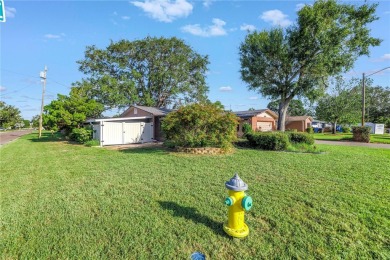 This well maintained concrete block corner home sustained flood on Mangrove Bay Golf Course in Florida - for sale on GolfHomes.com, golf home, golf lot