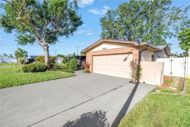 This well maintained concrete block corner home sustained flood on Mangrove Bay Golf Course in Florida - for sale on GolfHomes.com, golf home, golf lot