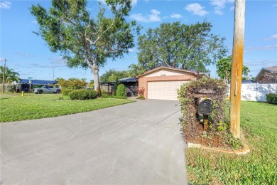 This well maintained concrete block corner home sustained flood on Mangrove Bay Golf Course in Florida - for sale on GolfHomes.com, golf home, golf lot