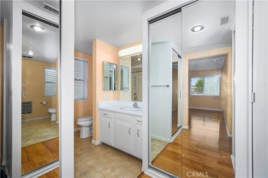 Step into this beautifully reimagined upstairs corner unit in on Leisure World Seal Beach Golf Course in California - for sale on GolfHomes.com, golf home, golf lot
