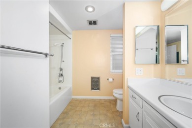 Step into this beautifully reimagined upstairs corner unit in on Leisure World Seal Beach Golf Course in California - for sale on GolfHomes.com, golf home, golf lot