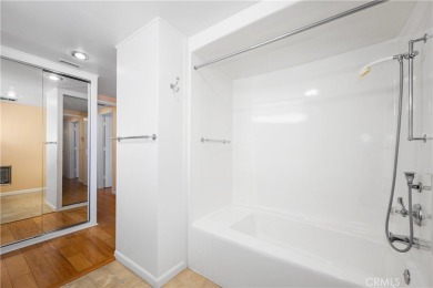 Step into this beautifully reimagined upstairs corner unit in on Leisure World Seal Beach Golf Course in California - for sale on GolfHomes.com, golf home, golf lot