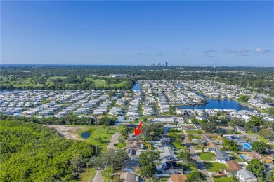 This well maintained concrete block corner home sustained flood on Mangrove Bay Golf Course in Florida - for sale on GolfHomes.com, golf home, golf lot