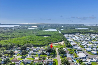 This well maintained concrete block corner home sustained flood on Mangrove Bay Golf Course in Florida - for sale on GolfHomes.com, golf home, golf lot