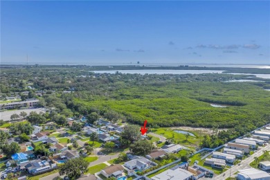 This well maintained concrete block corner home sustained flood on Mangrove Bay Golf Course in Florida - for sale on GolfHomes.com, golf home, golf lot