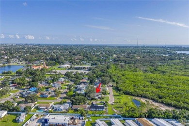 This well maintained concrete block corner home sustained flood on Mangrove Bay Golf Course in Florida - for sale on GolfHomes.com, golf home, golf lot