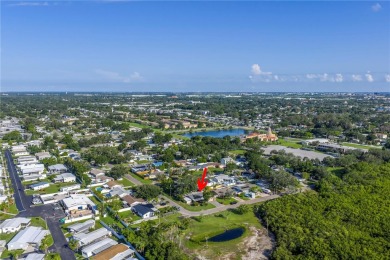 This well maintained concrete block corner home sustained flood on Mangrove Bay Golf Course in Florida - for sale on GolfHomes.com, golf home, golf lot