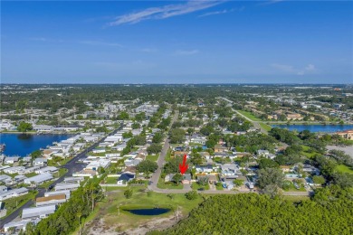 This well maintained concrete block corner home sustained flood on Mangrove Bay Golf Course in Florida - for sale on GolfHomes.com, golf home, golf lot
