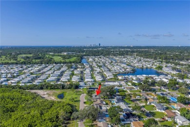 This well maintained concrete block corner home sustained flood on Mangrove Bay Golf Course in Florida - for sale on GolfHomes.com, golf home, golf lot
