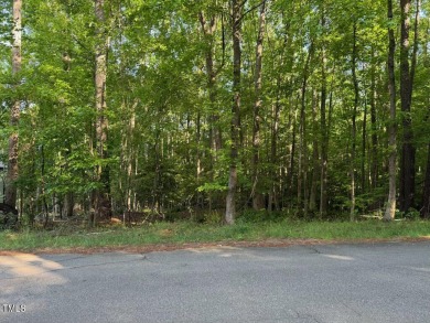 Private & wooded building lot on a quiet street of custom homes on River Golf and County Club at Lake Royale in North Carolina - for sale on GolfHomes.com, golf home, golf lot