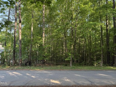 Private & wooded building lot on a quiet street of custom homes on River Golf and County Club at Lake Royale in North Carolina - for sale on GolfHomes.com, golf home, golf lot