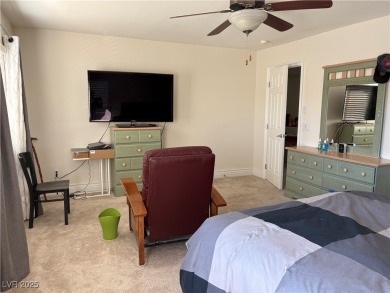 Step into this 2,891 sq ft residence, ideally located on a quiet on Rhodes Ranch Golf Club in Nevada - for sale on GolfHomes.com, golf home, golf lot