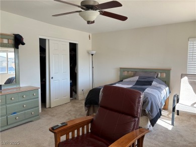 Step into this 2,891 sq ft residence, ideally located on a quiet on Rhodes Ranch Golf Club in Nevada - for sale on GolfHomes.com, golf home, golf lot