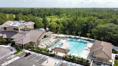 Explore this second floor, highly sought-after Brookside floor on Cedar Hammock Golf and Country Club in Florida - for sale on GolfHomes.com, golf home, golf lot