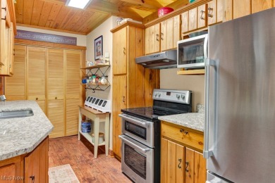This beautifully maintained log home offers charm, character on Lake Mohawk Golf Club in Ohio - for sale on GolfHomes.com, golf home, golf lot