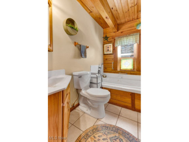 This beautifully maintained log home offers charm, character on Lake Mohawk Golf Club in Ohio - for sale on GolfHomes.com, golf home, golf lot