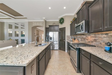 Experience stunning water views from this beautifully updated on Esplanade Golf and Country at Lakewood Ranch in Florida - for sale on GolfHomes.com, golf home, golf lot