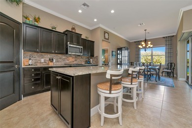 Experience stunning water views from this beautifully updated on Esplanade Golf and Country at Lakewood Ranch in Florida - for sale on GolfHomes.com, golf home, golf lot