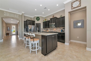 Experience stunning water views from this beautifully updated on Esplanade Golf and Country at Lakewood Ranch in Florida - for sale on GolfHomes.com, golf home, golf lot