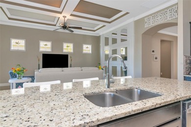 Experience stunning water views from this beautifully updated on Esplanade Golf and Country at Lakewood Ranch in Florida - for sale on GolfHomes.com, golf home, golf lot